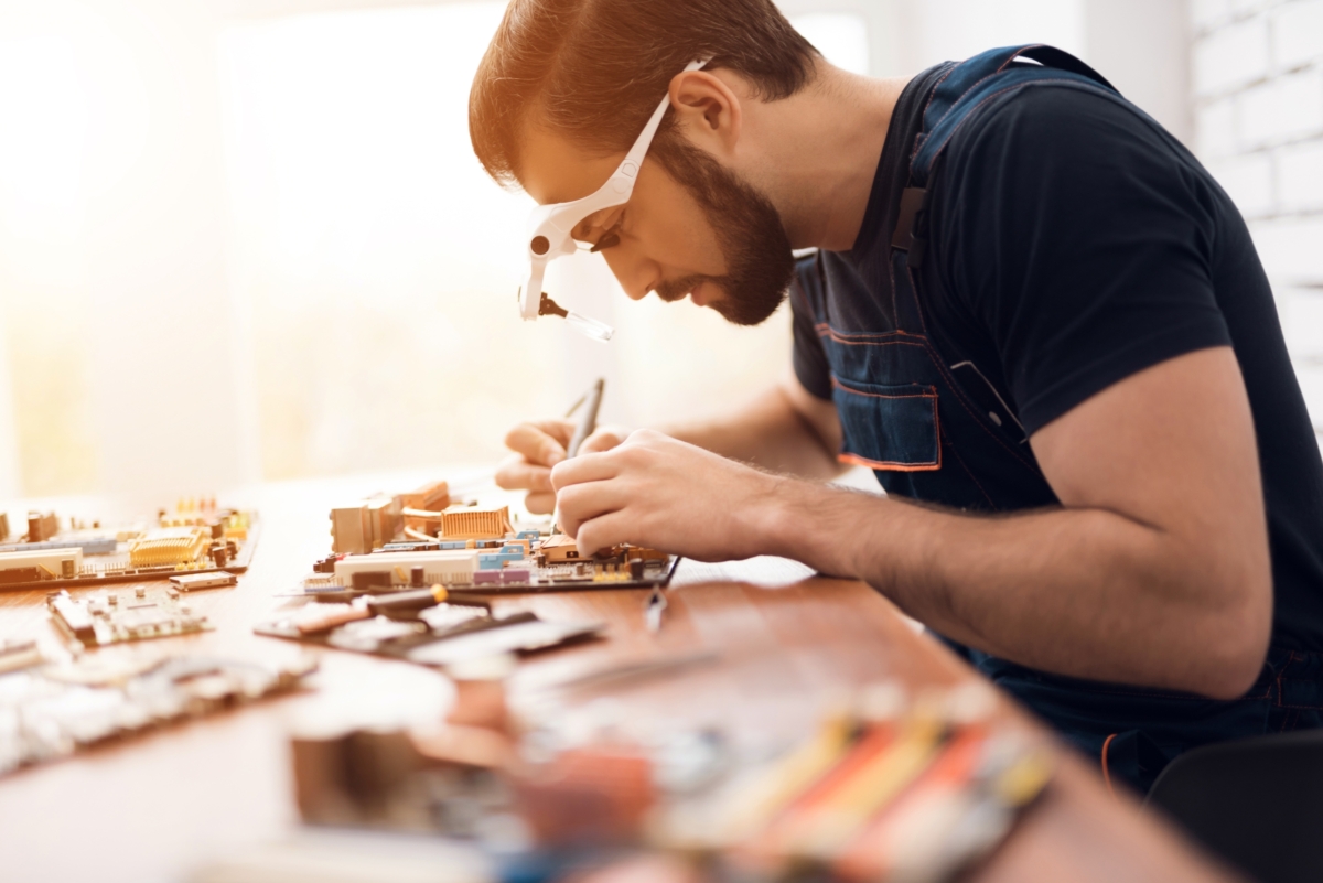Man repairing a computer